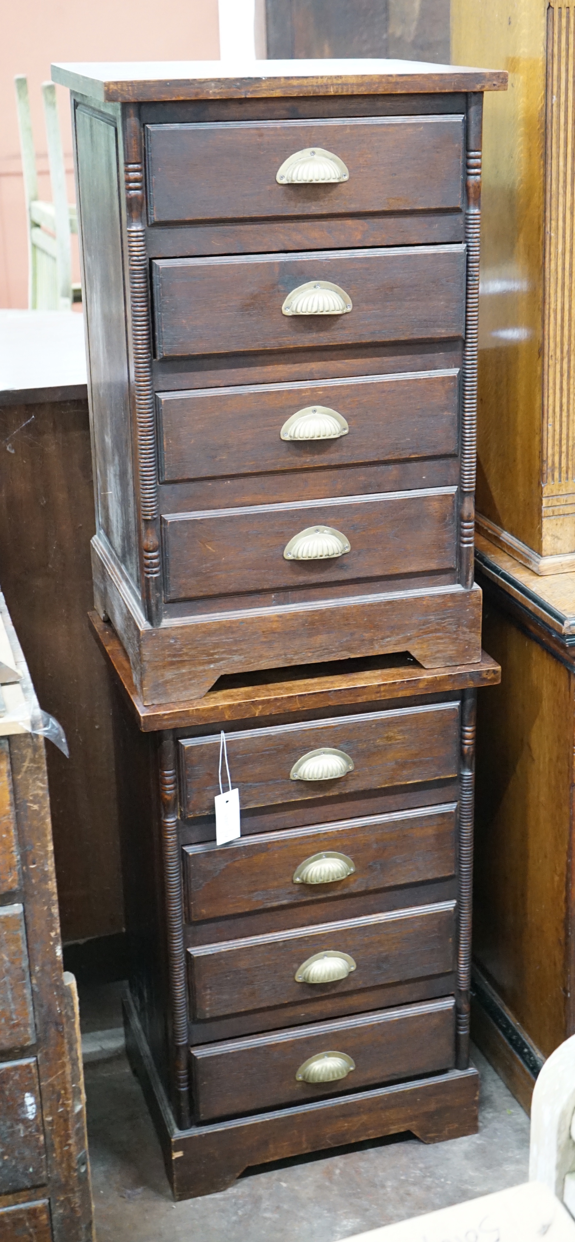 A pair of hardwood four drawer bedside chests, width 47cm depth 38cm height 74cm